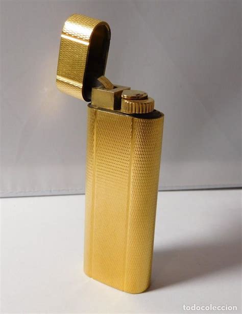 mechero cartier oro